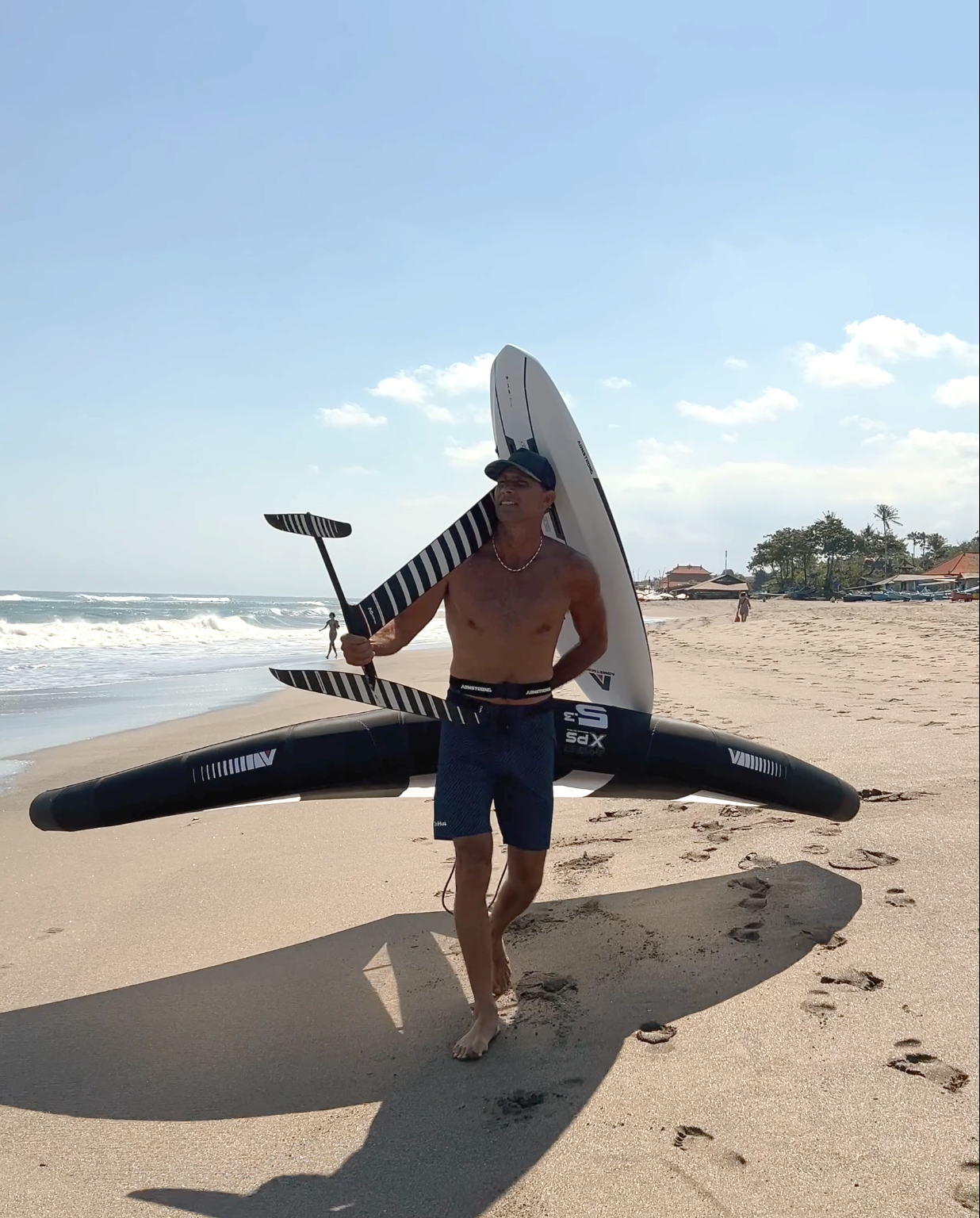 Sky Rama with foil board on the beach in Bali